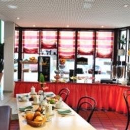 Sala de desayuno Atelier Garni Fotos