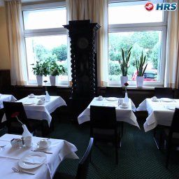 Salle du petit-déjeuner située dans le restaurant An der Gruga