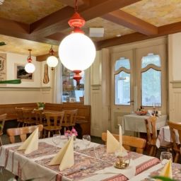 Breakfast room within restaurant Waldhotel Unspunnen