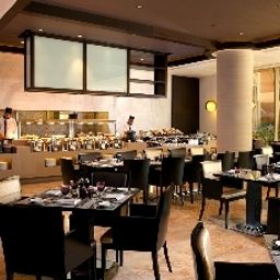 Sala de desayuno en el restaurante Gefinor Rotana Hotel