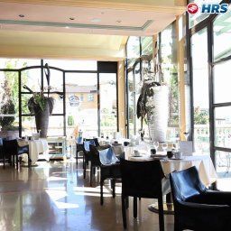 Salle du petit-déjeuner située dans le restaurant Villa Florentine
