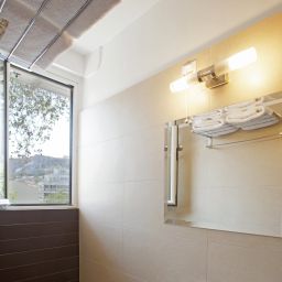 Cuarto de baño Metropolis Hotel