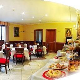 Sala de desayuno en el restaurante Tricolore Fotos