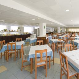 Sala de desayuno en el restaurante Piscis Park