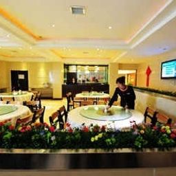 Salle du petit-déjeuner située dans le restaurant Log Hotel Dongshan - Yichang Fotos