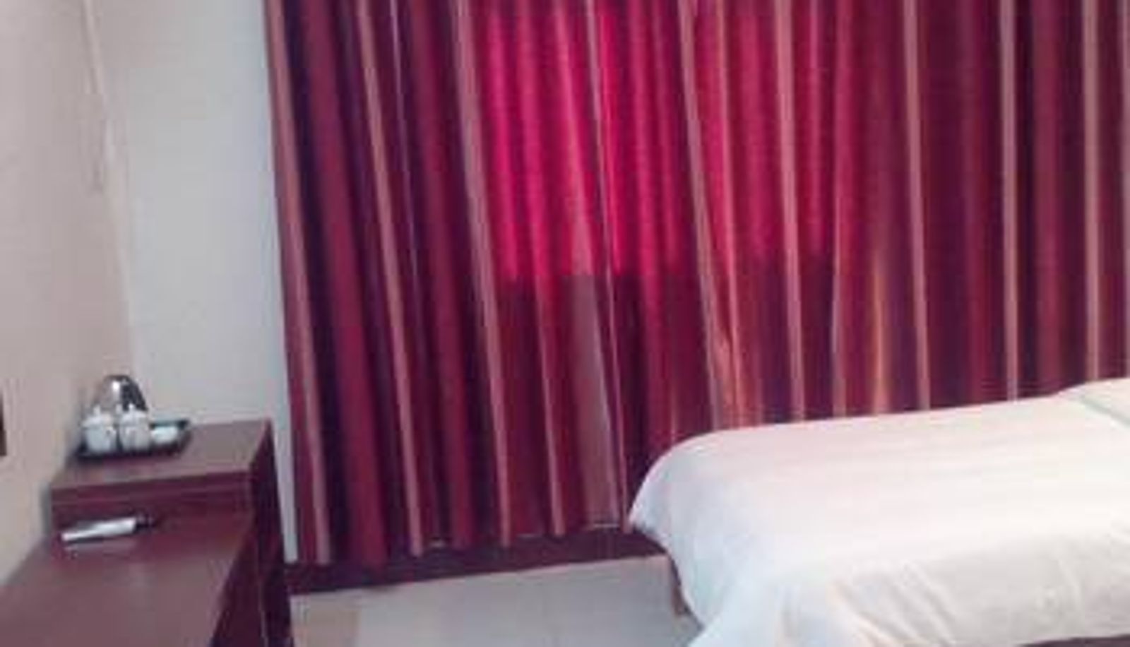Zimmer - Longmen Hengtong Motel