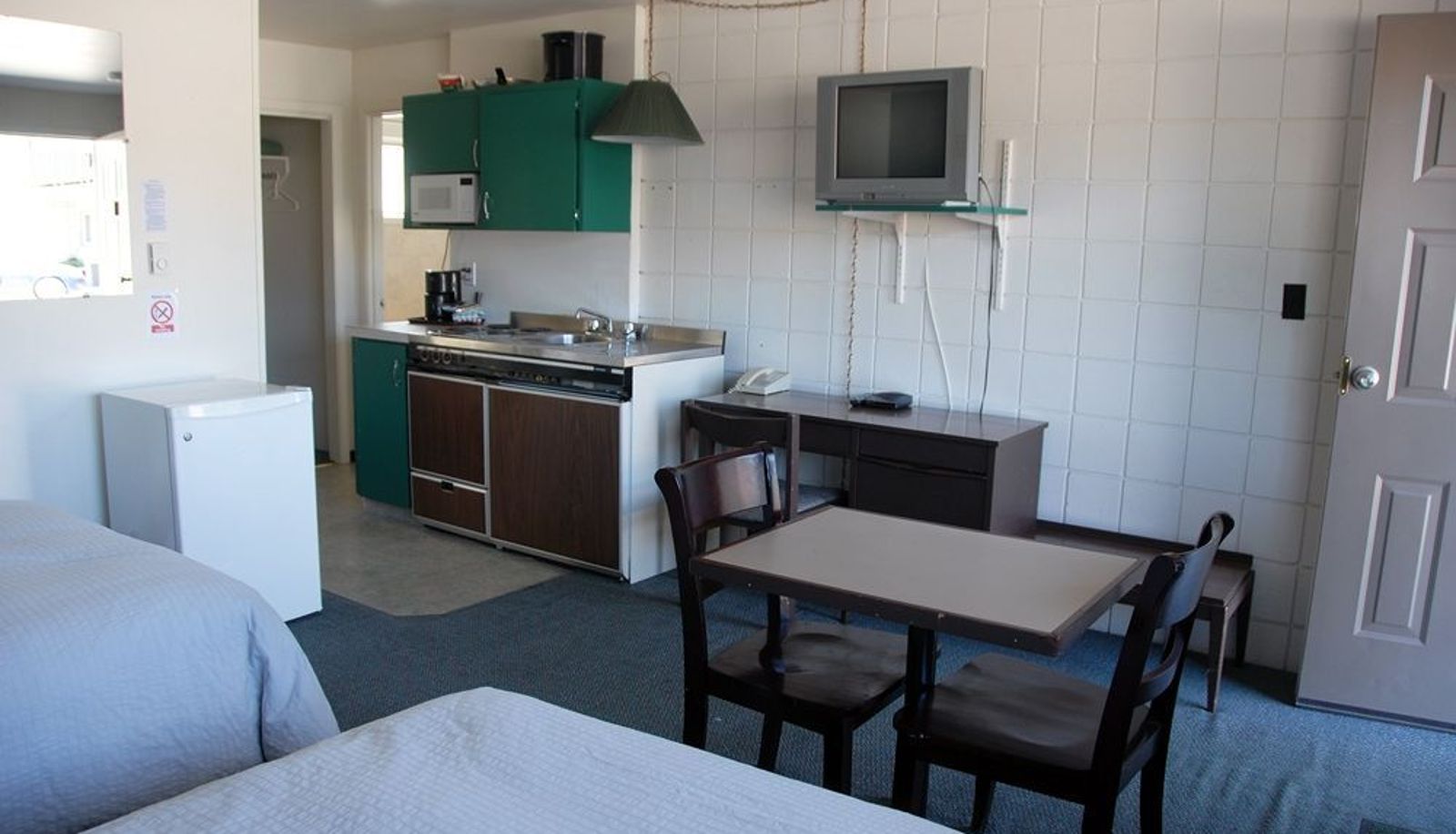 Kitchen area in the room - The Canterbury Inn of Downtown Invermere