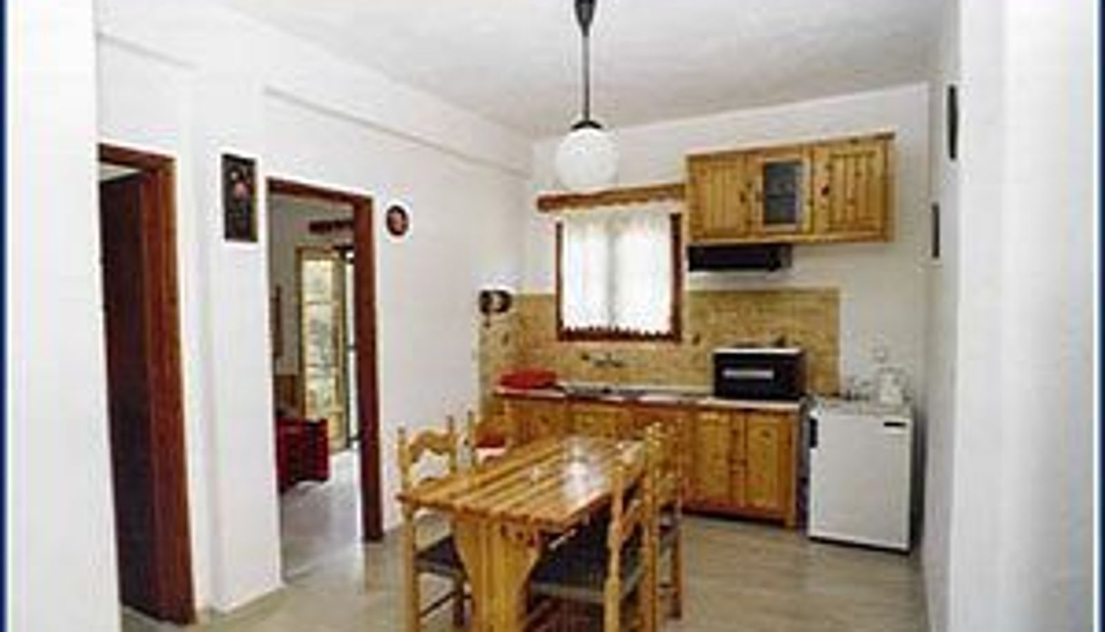 Zona de cocina en la habitación - Vasilis Studio