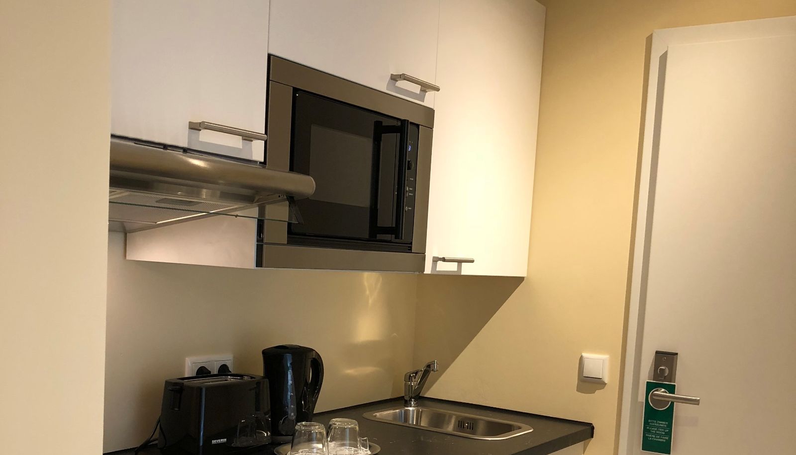 Zona de cocina en la habitación - Select Suites & Aparts