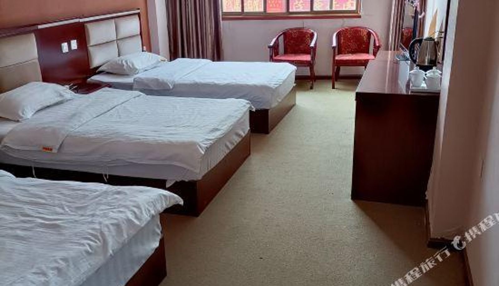 Zimmer - Luoping Huaxuan Hotel