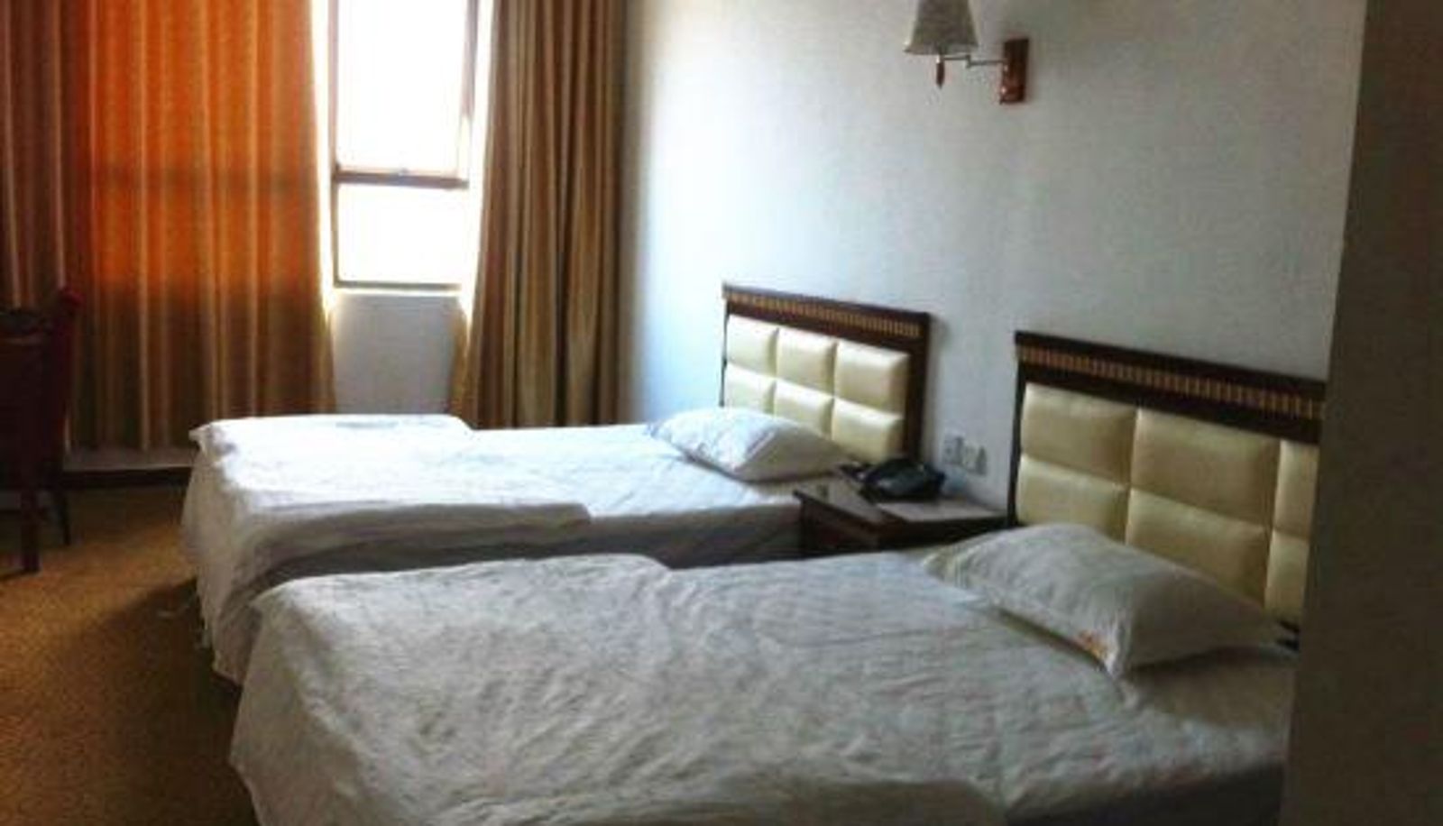 Zimmer - Xinyang Zhuangjiayuan Hotel