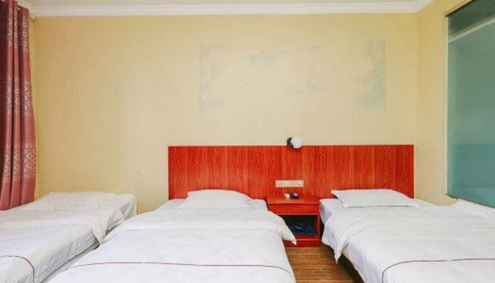 Chambre - Manqini Hotel in Xishuangbanna