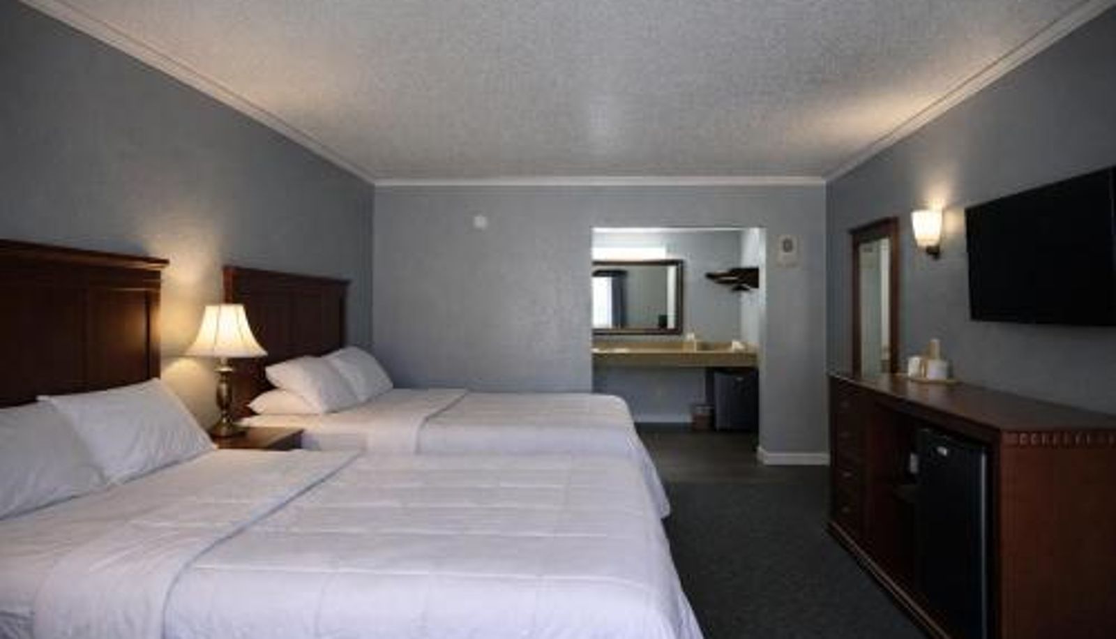 Chambre - Quarters Inn & Suites