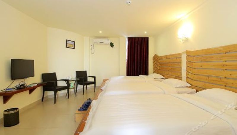 Dreibettzimmer - Longfu Holiday Hotel