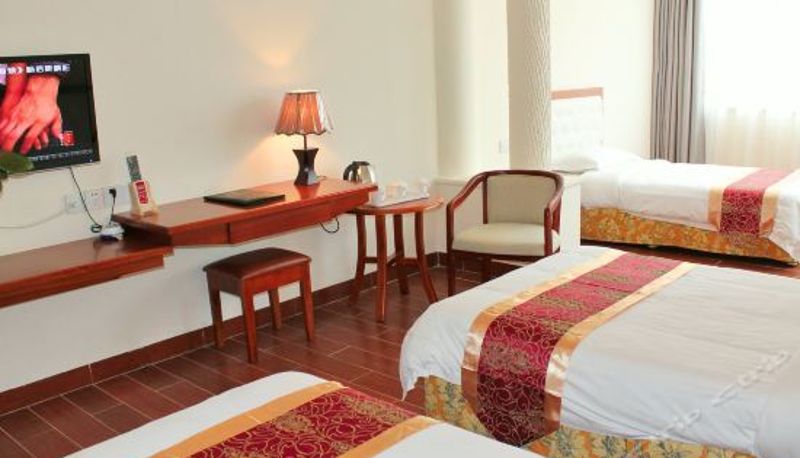 Dreibettzimmer - The New Huikang Hotel