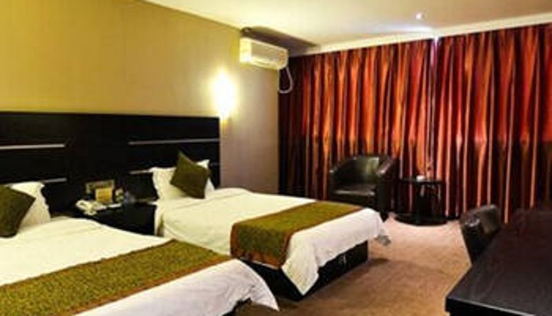 Zimmer - Xiyi Business Hotel (Wanda Plaza Store)