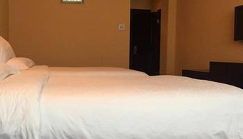 Zimmer - Dongya Business Hotel (Shimao Motiancheng Store)