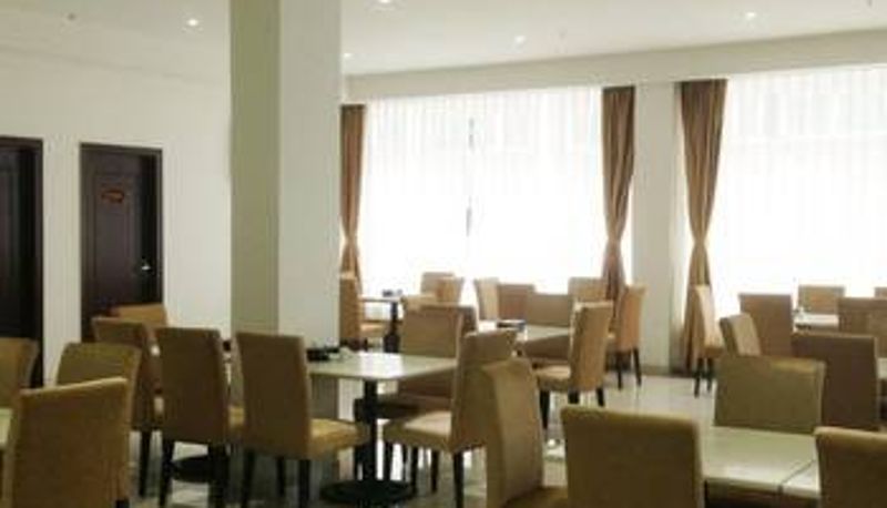 Sala de desayunos dentro del restaurante - Gurao Shenglin Hotel