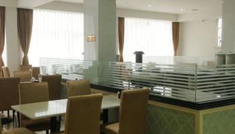 Sala de desayunos dentro del restaurante - Gurao Shenglin Hotel