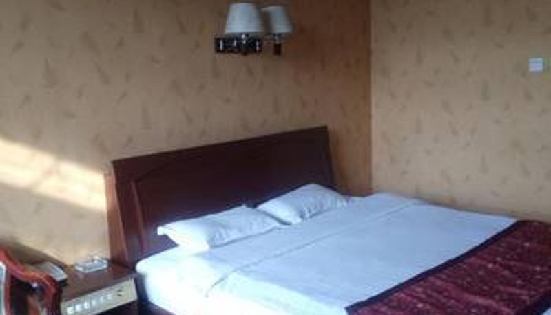 Zimmer - Friendship Business Hotel (Qilu Street Branch)