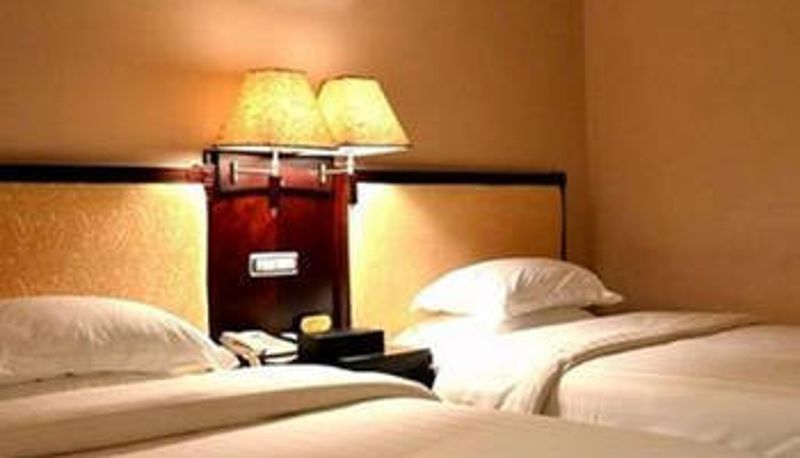 Habitación - Golden Bauhinia Hotel