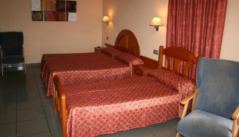 Room - Hotel El Pinche de Oro 3000