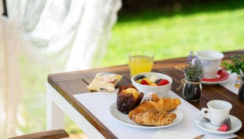 Salle de petit-déjeuner dans le restaurant - B&B Isabella