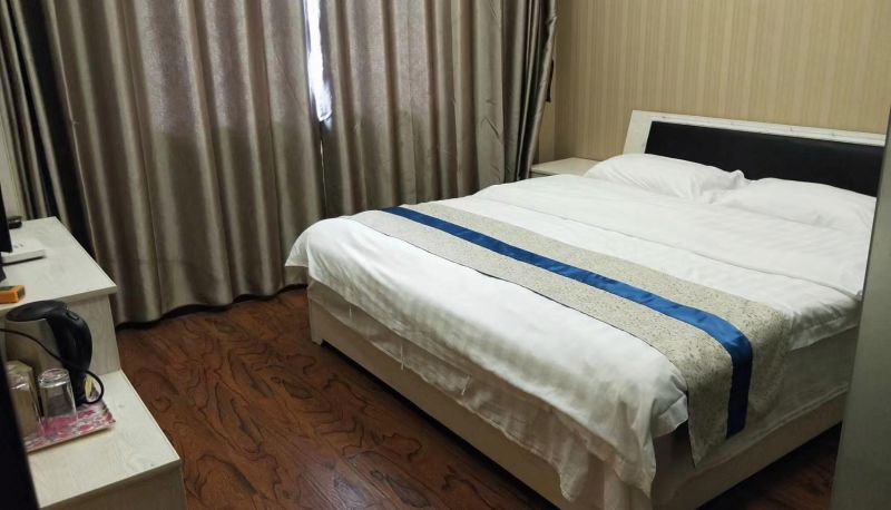 Kamer - Huayi Business Hotel