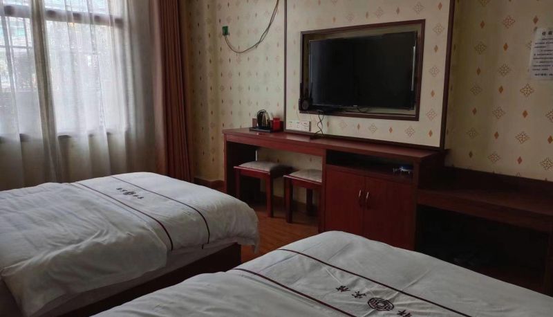 Habitación - Jixiang Hotel (Lancang Passenger Station Store)