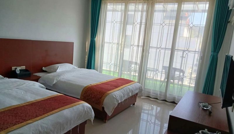 Zimmer mit Balkon - Wanshun Hotel (Tiantangzhai Scenic Area Store)