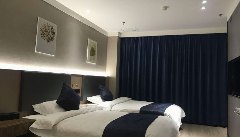 Zimmer - Huayi Hotel (Home Inn's Kuche Tianwu Square Branch)