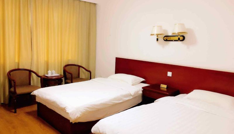 Zimmer - Huayue Hotel (Xinghai South Road Branch)