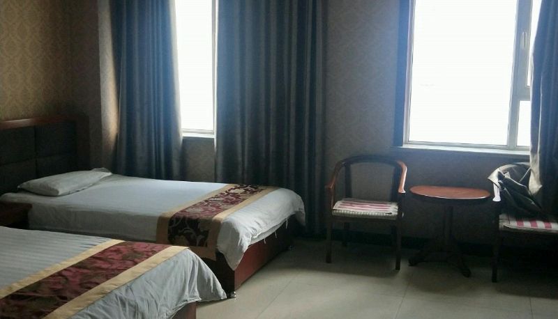 Zimmer - Hexin Business Hotel