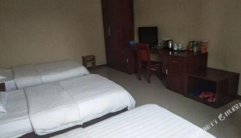Zimmer - Gushi Longxing Hotel