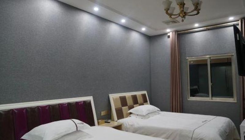 Zimmer - Xichong Huayi Hotel