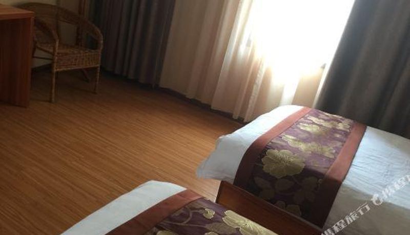 Zimmer - Maitreya Sanxin Express Hotel