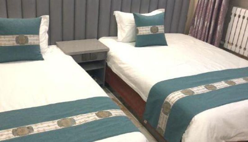Chambre Familiale - Xinyouru Business Hotel (Yakeshi Branch)