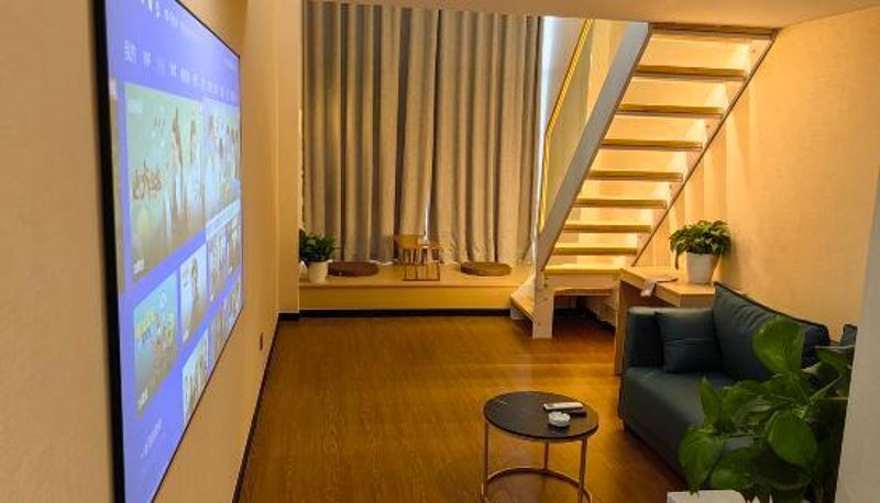 Zimmer - Qiuguo LOFT Smart Cinema Apartment (Rizhao China Resources Wanxianghui Branch)