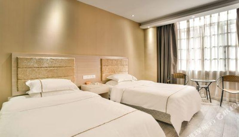 Habitación - Xin Tian Di Business Hotel
