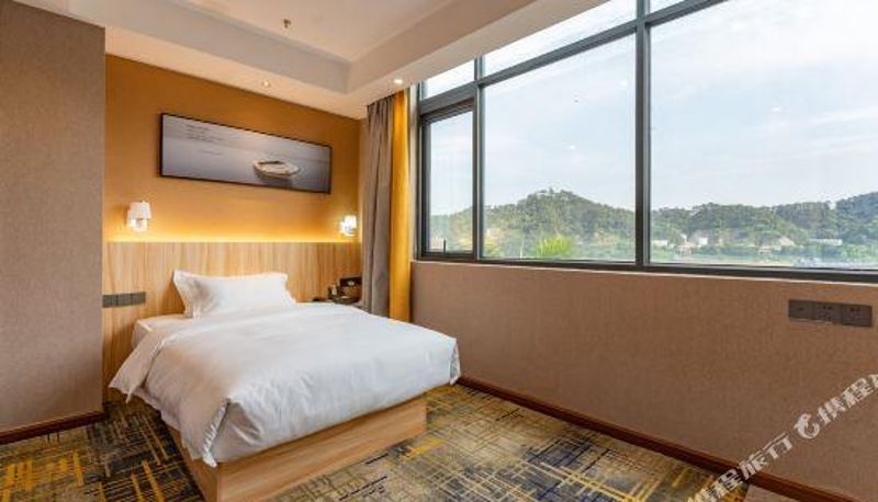 Zimmer - Huangyue Hotel (Wuzhou Arcade City)