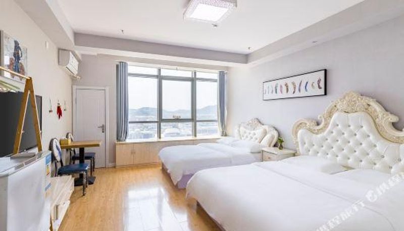 Pokój z widokiem na góry - Tuyuan Holiday Apartment (Weihai Railway Station Hanlefang West Street)