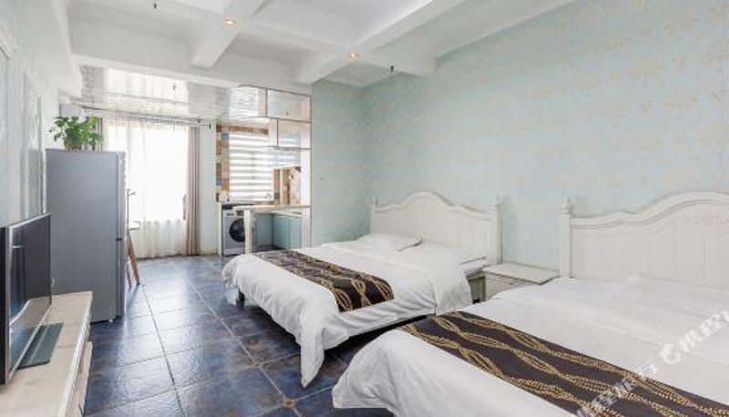 Family room - Tule Boutique Holiday Apartment (Weihai Hanlefang Railway Station Store)