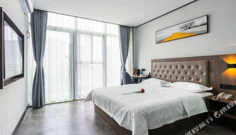 Zimmer - Sanhao Holiday Hotel (Wuhan Nanshan Optics Valley Free Trade Port Foxconn Technology Park Branch)