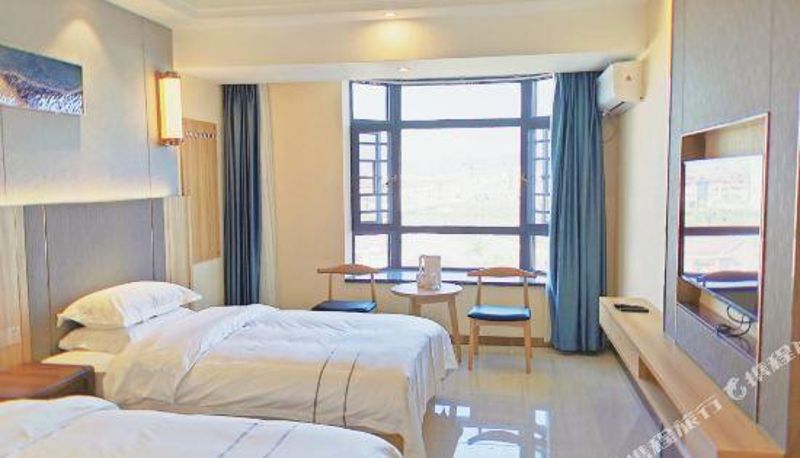 Habitación - Ruili Huaju Apartment