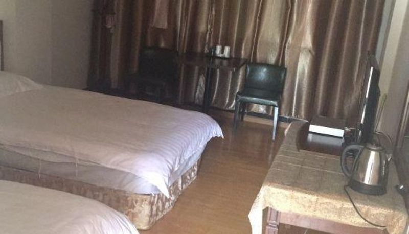 Zimmer - Ruili Kaixuan Hotel