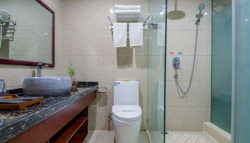 Kamer met balkon - Jinglong Dai Holiday Hotel