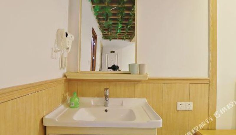 Zimmer - Qionghai Wanziqianhong Serviced Apartment
