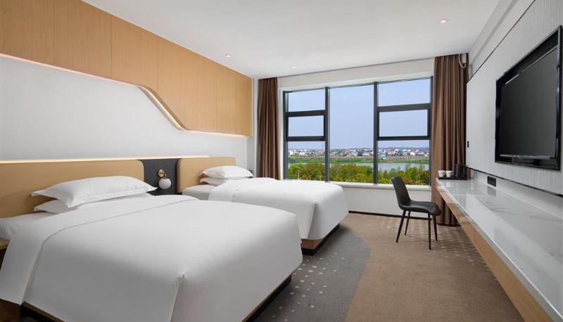 Zimmer - Microtel by Wyndham Miluo Downtown Hotel