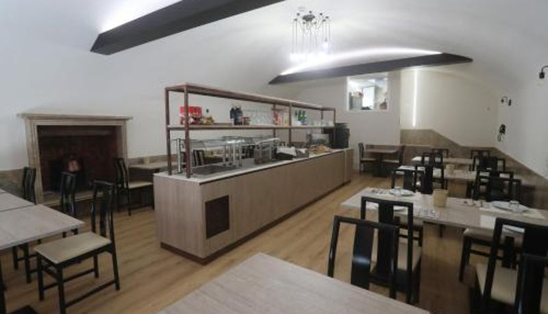 Salle de petit-déjeuner dans le restaurant - Hotel Central Giacomini