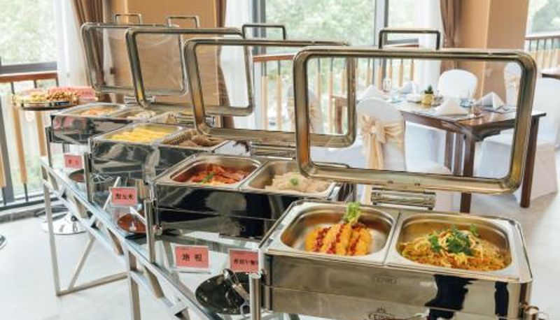 Sala prima colazione all'interno del ristorante - White Swan Guest House MeiZhou